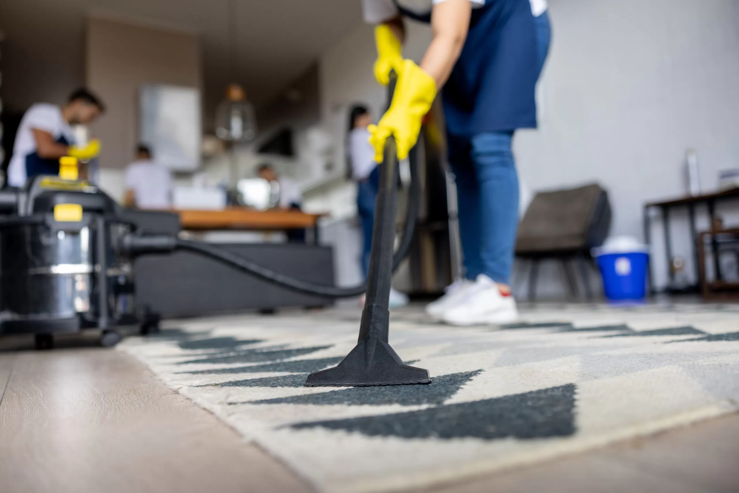 Residential cleaning professional carefully cleaning a kitchen